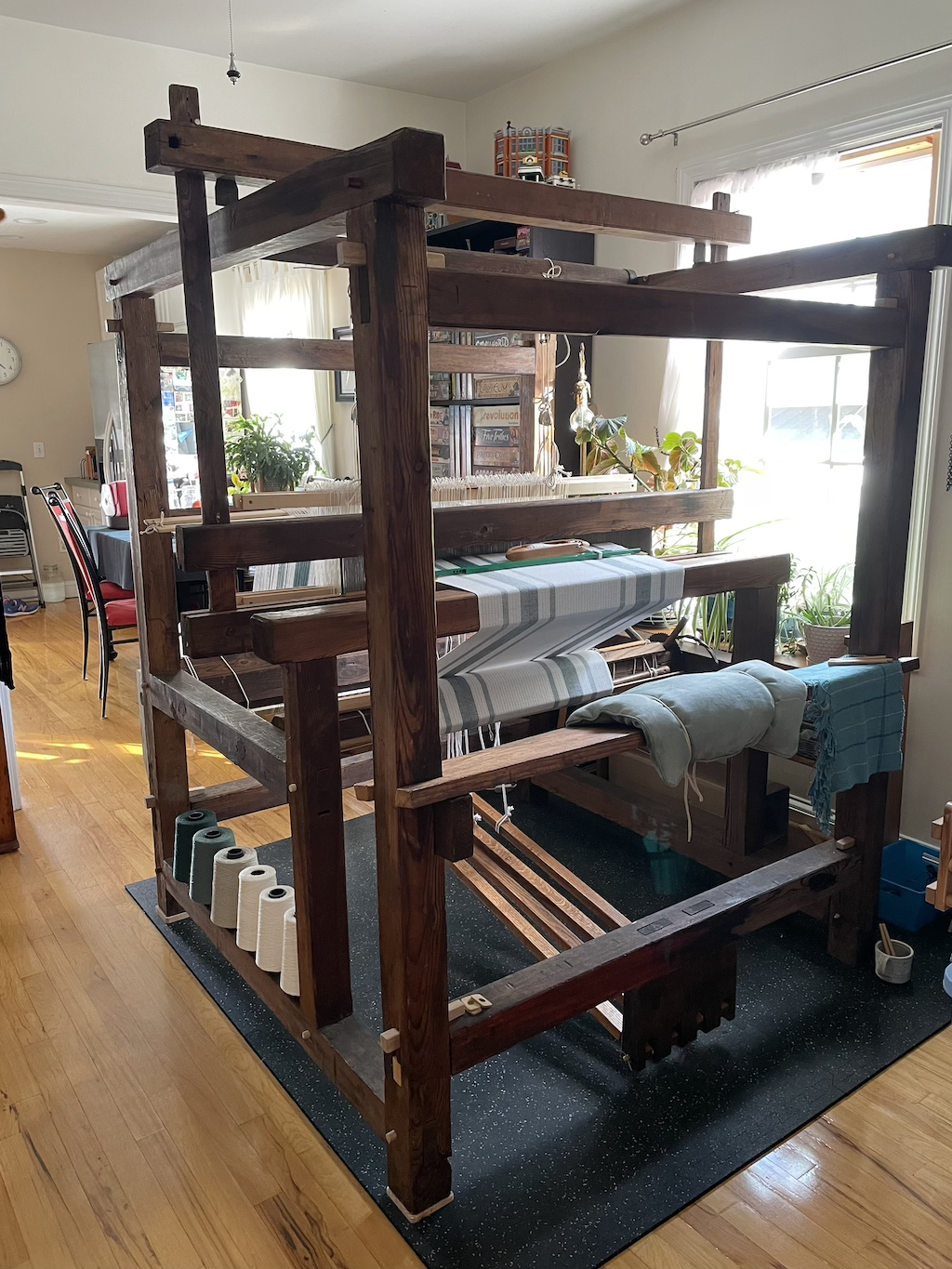 Weaver working at a floor loom